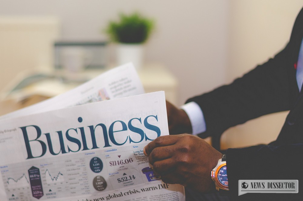 A man reading a business paper