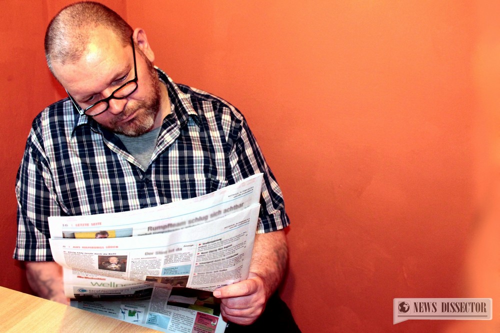 A man reading a newspaper