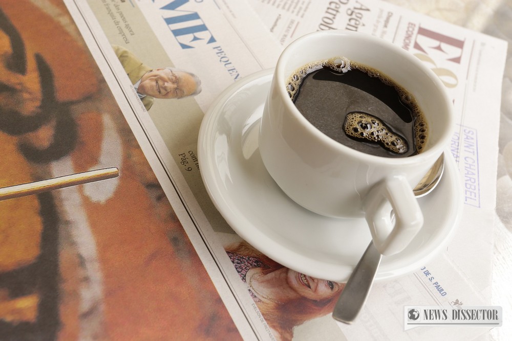 Newspaper with a cup of coffee